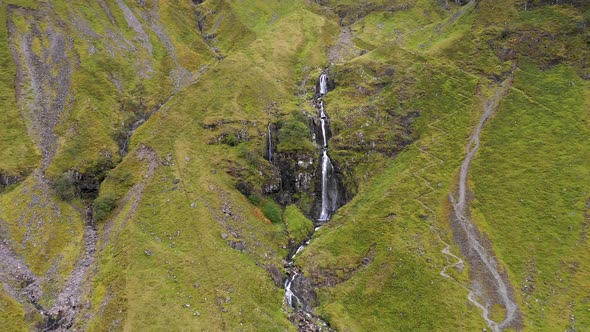 Aerial view of a waterfall in the highlands in Scotland