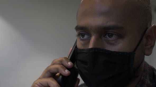 Adult Male Wearing Face Mask Talking On Mobile Phone Call. Locked Off , Close Up alt