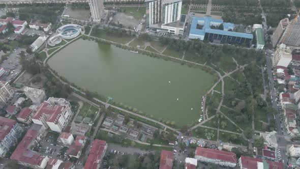 Top aerial view of beautiful lake in the center of Batumi. flying over 6 May park. Georgia alt