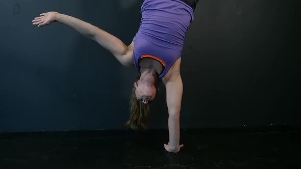 Fitness Girl Doing Gymnastic Exercises at Fitness Gym. Young Woman Exercising Fitness