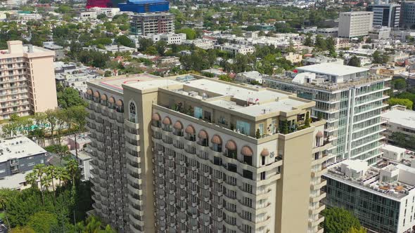 Aerial approach of high-rise apartment buildings in Beverly Hills alt
