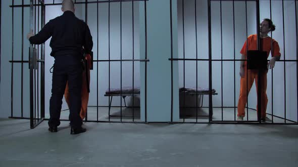 The Jailer Locks the Criminal in the Cell alt