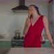 Joyful Woman Singing Into Spatula in Kitchen - VideoHive Item for Sale
