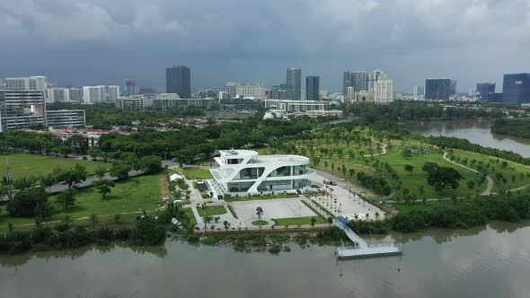panning drone shot of ultra modern residential and commercial lakeside development area with green s alt