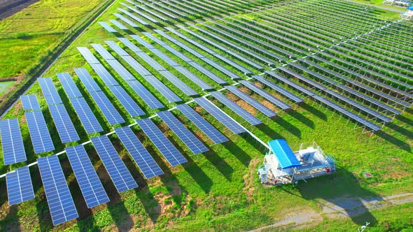 Drone fly over solar farm, renewable energy from solar. alt