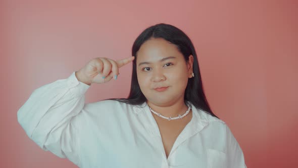 Asian Plus Size Woman in White Shirt Shows Stupid alt