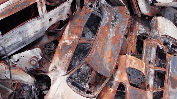 Vertical Video of Burnt Cars During the War in Ukraine alt
