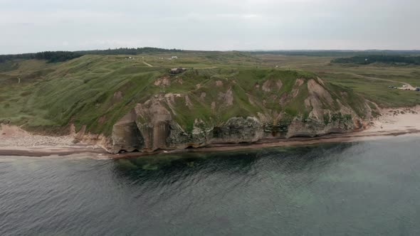 Breathtaking Drone Shotof Bulbjerg Limestone Cliff in Denmark and Ocean Waters alt