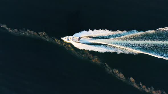 Boat Going Through the Polluted Sea with a Wave Top View alt