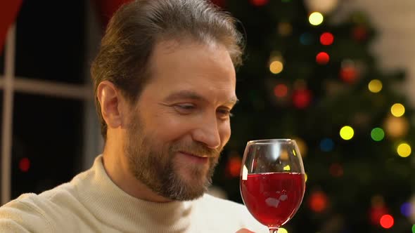Young Couple Drinking Wine at Christmas, Romance and Festive Mood, Closeup alt