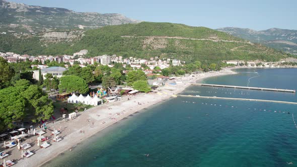 Aerial View Budva Beach By Sea with Sun Loungers and People Seashore Montenegro alt