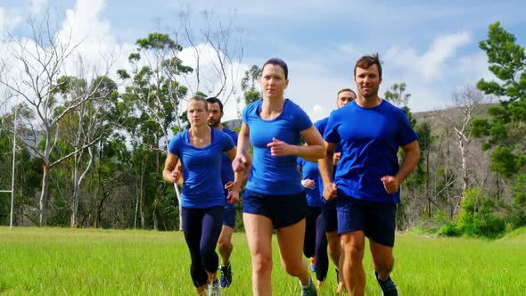 Fit people jogging in boot camp 4k alt