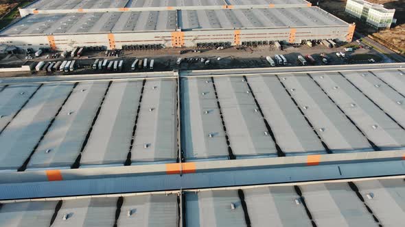 Motion Above Warehouses Roofs and Big Trucks Parking Lot alt