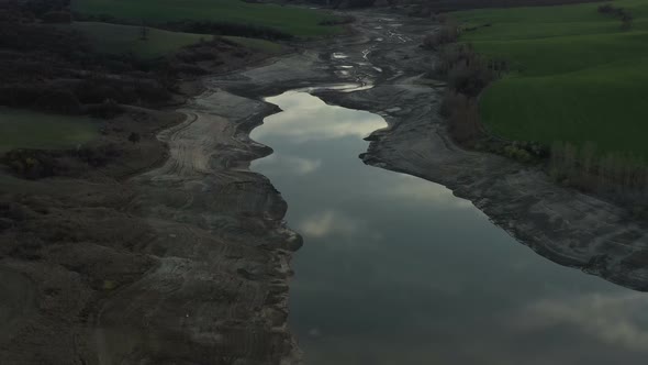 Aerial View Of Half Empty Reservoir alt