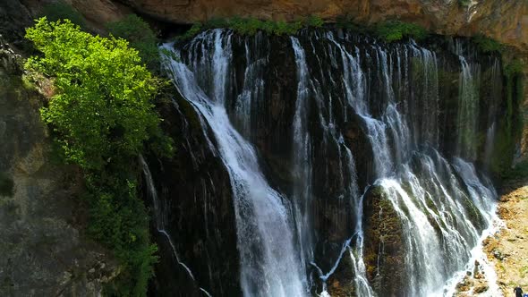 Waterfall Flowing On Rocks  alt