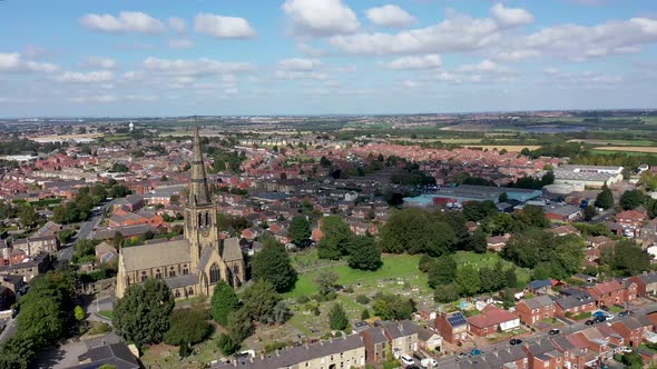 Aerial footage of the British town of Ossett, a market town in the UK alt