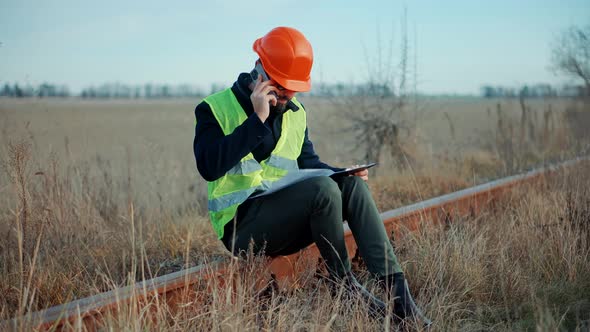 Mechanical Rail Engineer Wearing Safety Uniform Safety Helmet. Foreman Inspection Checking Railroad. alt