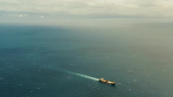 Cargo Ship in the Open Blue Sea Philippines alt