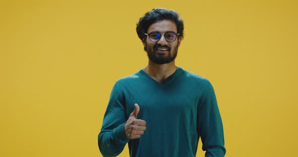 Young Man Showing Thumbs Up alt