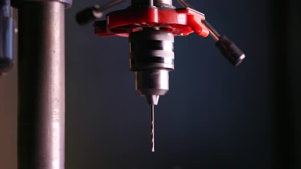 Slider Pan Shot of a Drilling Machine Rotation in Workshop alt