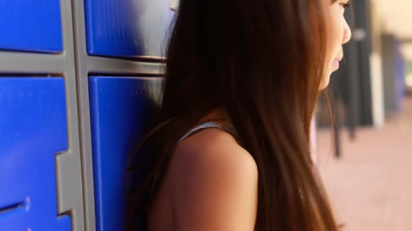 Thoughtful girl sitting in locker room 4k alt
