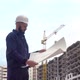 Portrait of a Successful Young Engineer Architect Builder Businessman Wearing a White Helmet in a - VideoHive Item for Sale