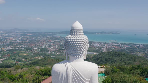 White Buddha Statue in Thailand Standing on the Top of Mountain