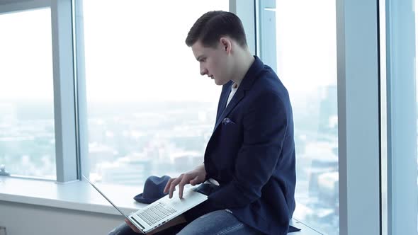 Student With Laptop at the University