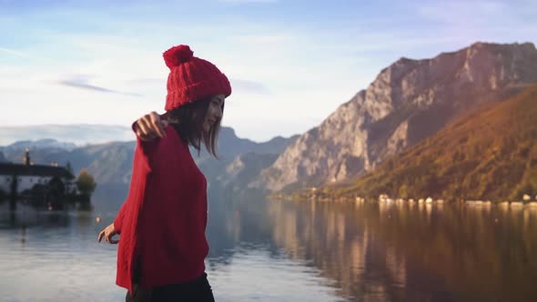 Travel Adventure Lifestyle. Pretty Woman Walking in Front of Alpen Mountains at Sunset. Picturesque alt
