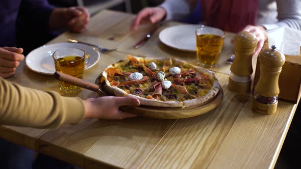 Couple in Restaurant Waits for Ordered Pizza alt