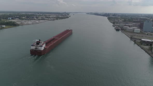 This video is of an aerial of large tanker ships in the Detroit river near downtown Detroit. alt