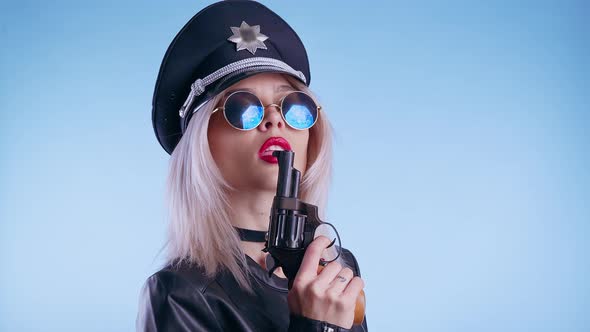 Woman Dressed As a Police Officer with Gun