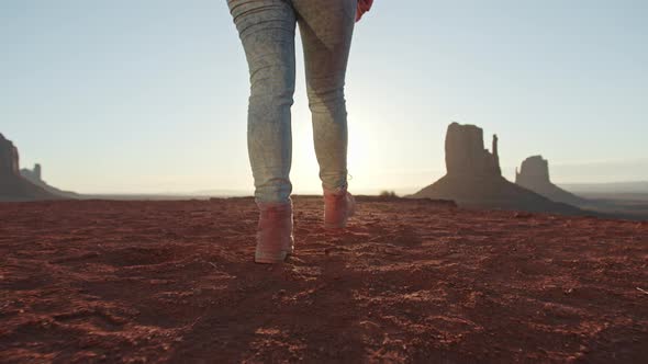 Closeup of Travelers Feet in Pink Outdoor Hiking Boots Walking in Golden Sunset alt