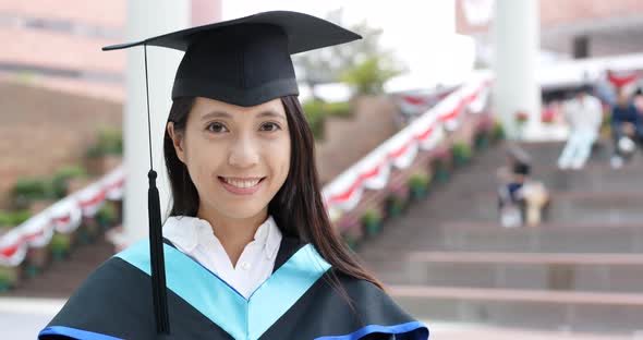 Woman with graduation gown in university gown alt