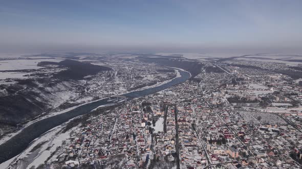 Aerial Panorama of a Small Town and Canyon at Winter Day alt