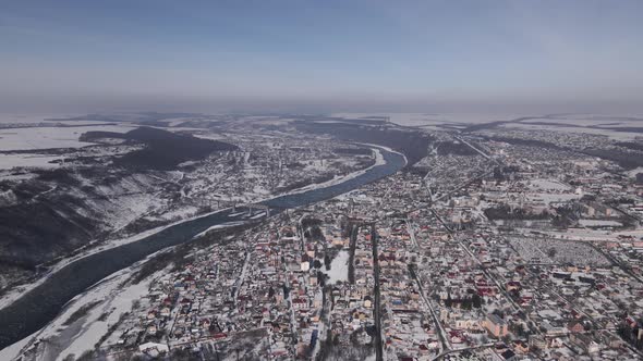 Aerial Panorama of a Small Town and Canyon at Winter Day