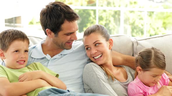 Cute Family Relaxing Together on the Couch alt