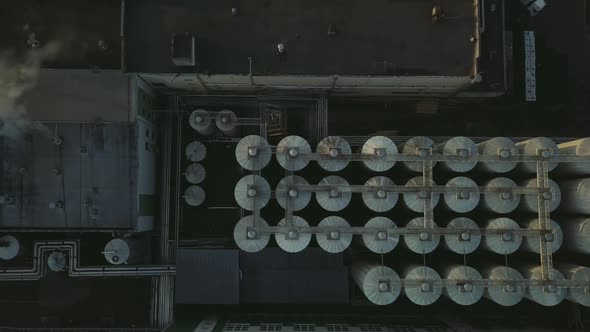 Aerial View of a Drone Flying Over the Beer Production Plant Several Rows of Tanks