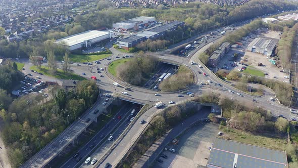 Aerial footage of a large section of commuter motorway, highway, during busy congestion, traffic, ru alt