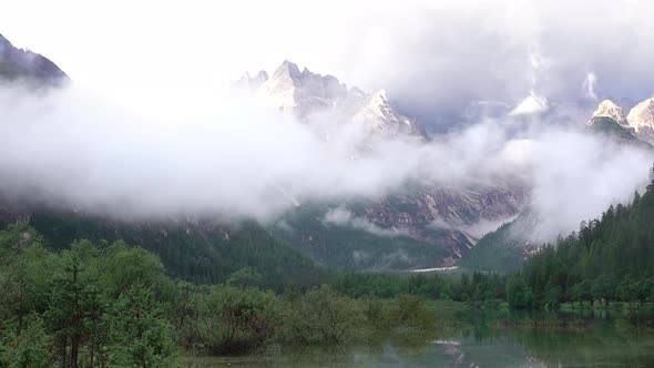 Mixture of Clouds with a Mist over a Mountain Lake