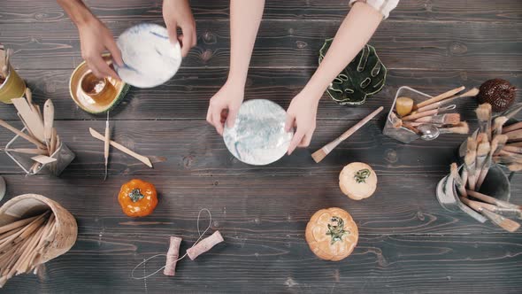 Top View Potter Making Ceramic Bowls and Plates Woman Hands Painting Color Handmade Traditional alt