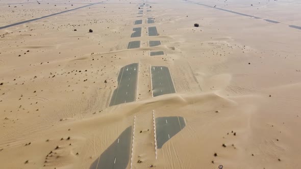 the Road Is Covered with Sand in the Desert