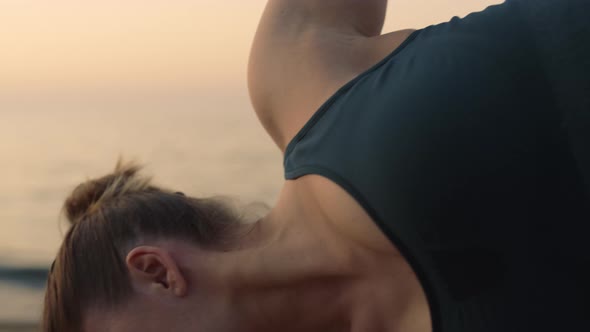 Yogi Woman Standing Half Moon Pose on Beach Closeup alt