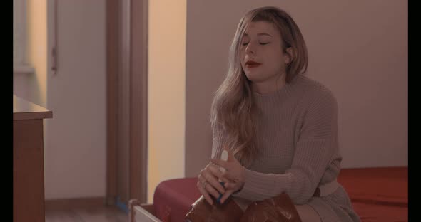 unwanted pregnancy -young woman desperate after seeing the pregnancy test alt