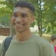 Portrait of Charming Black Male Student Looking with Cheerful Smile Outdoor - VideoHive Item for Sale