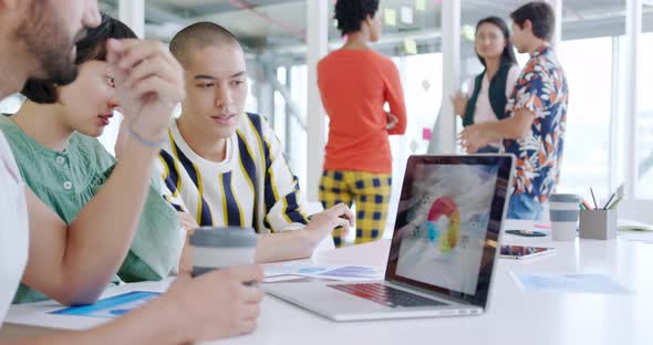 Creatives working in a modern office alt