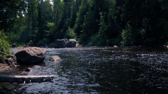 The Baptism River flowing through Tettegouche State Park Minnesota. The relaxing forest and calm flo alt