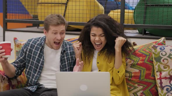 Euphoric Couple Cheerful Male Female Read Unbelievable News on Laptop Celebrate Success Look Very alt
