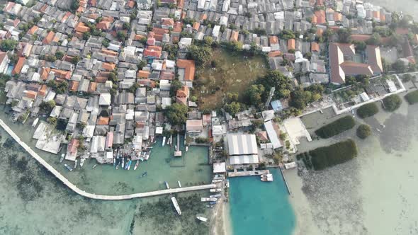 Cinematic overhead aerial view of Harapan island in seribu islands, Indonesia.