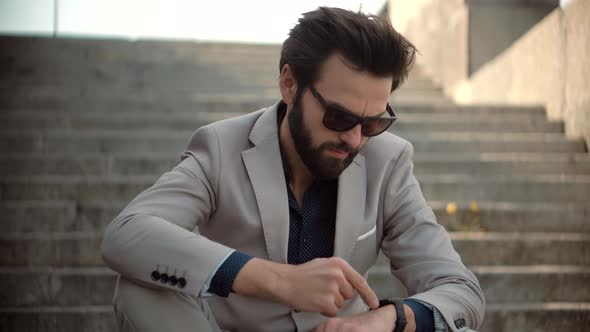 Businessman Scrolling On Display On Smartwatch. Male Checking Pulse Smartwatch App. Smart Band. alt